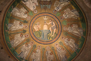 A vibrant mosaic illustrating the life of Jesus, prominently displayed in the center of a grand dome.